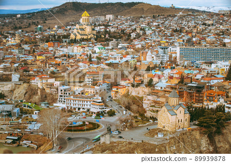 Tbilisi, Georgia. Elevated top Scenic View Famous Landmark Sameba Church, Metekhi church, Gorgasali monument. Georgian Capital Skyline Cityscape Time lapse timelapse. Tbilisi, Georgia. Top View 89939878