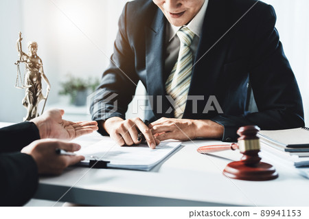 Law, Consultation, Agreement, Contract, Attorney or Lawyer holding a pen is consulting with a client to explain the pattern of answering questions before going to court to decide a lawsuit 89941153
