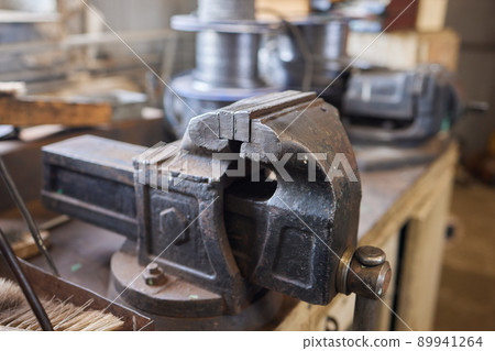 Close up hand heavy industrial worker is working on metal work factory process by performing mechanical turning operation at machine for steel structure industry. Close up hand heavy industrial worker is working on metal work factory process by performing mechanical turning operation at machine for steel structure industry. 89941264