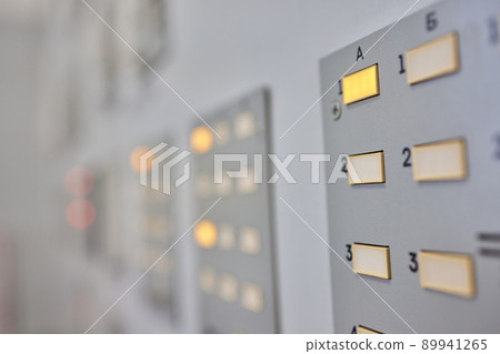 Electrical control cabinet on gray wall close-up. Electrical control cabinet on gray wall close-up. 89941265