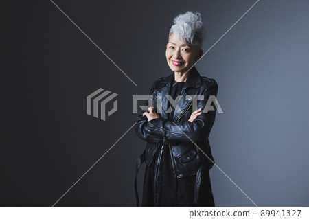 Gray-haired woman in a rider's jacket Gray-haired woman in a rider's jacket 89941327