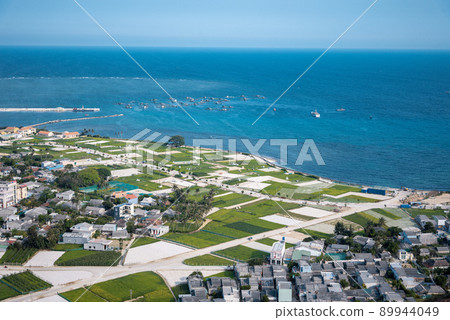 high view from Thoi Loi Mountain, fishing village and garlic fields at Ly Son island, Quang Ngai Province, Viet Nam high view from Thoi Loi Mountain, fishing village and garlic fields at Ly Son island, Quang Ngai Province, Viet Nam 89944049