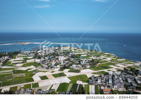 high view from Thoi Loi Mountain, fishing village and garlic fields at Ly Son island, Quang Ngai Province, Viet Nam high view from Thoi Loi Mountain, fishing village and garlic fields at Ly Son island, Quang Ngai Province, Viet Nam 89944050