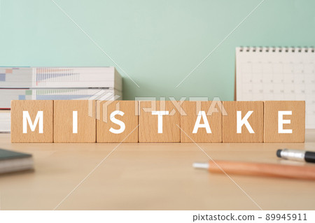 Image of mistake | Desk with building blocks with "MISTAKE" written on it 89945911