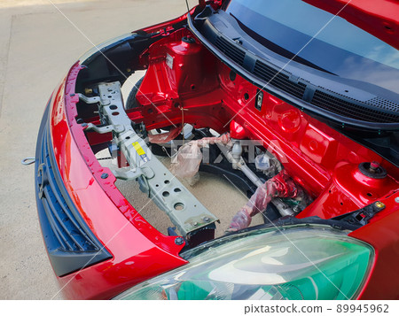 Checking car body work fiber bumper at car garage 89945962