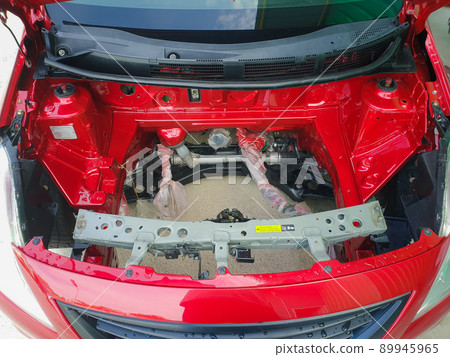 Checking car body work fiber bumper at car garage 89945965