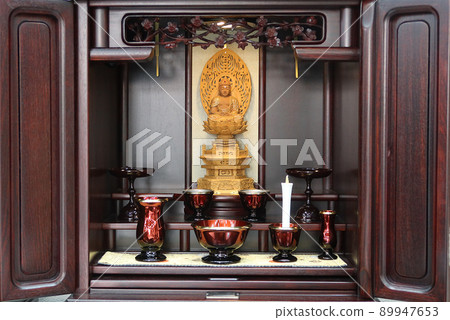 A sitting statue of Buddha and modern Buddhist altars displayed in a small Buddhist altar 2 89947653