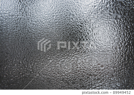 Abstract pattern of melt water on the window glass. 89949452