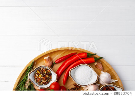 Various spices on white wooden background, close up. 89953704