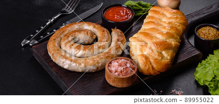 Baked homemade sausage with spices and herbs, close up Baked homemade sausage with spices and herbs, close up 89955022