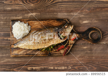 Yellow tailed mackerel with rice baked in oven 89956515