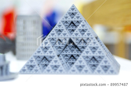 Abstract model pyramid printed on 3d printer. Object photopolymer printed on stereolithography 3D printer. Technology of liquid photopolymerization under UV light. New additive 3D printing technology 89957487
