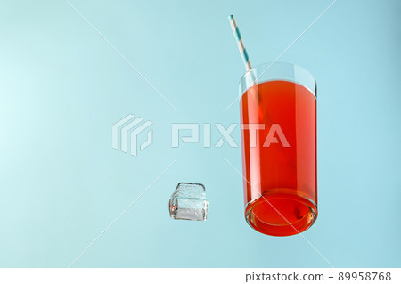 Red cocktail summer party in a glass with a pipe and ice Red cocktail summer party in a glass with a pipe and ice 89958768