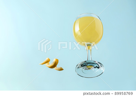 Bright summer lemon tropical cocktail in a glass for a party or picnic Bright summer lemon tropical cocktail in a glass for a party or picnic 89958769