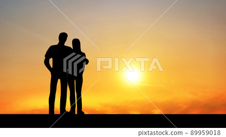 Silhouettes of men and women standing with their shoulders _ sunset background _ wide 89959018