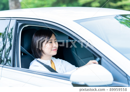 A woman driving a car A woman driving a car 89959558