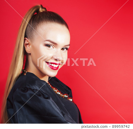 young pretty woman young lady posing on red background, lifestyle people concept close up 89959742