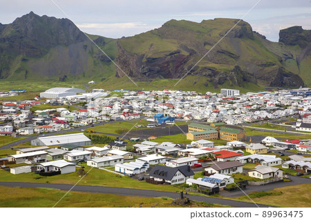 View of the houses and buildings on the Heimaey Island of the Vestmannaeyjar Archipelago. Iceland View of the houses and buildings on the Heimaey Island of the Vestmannaeyjar Archipelago. Iceland 89963475