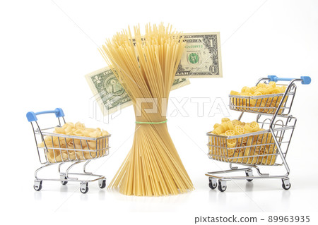 italian pasta in a grocery basket from the market with a dollar bill on a white background 89963935