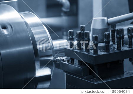 The lathe machine finish cutting the brass disk parts by lathe tools. 89964024