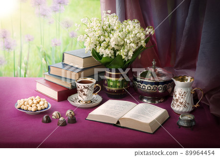 Still life from ancient book and lush boquet Still life from ancient book and lush boquet 89964454