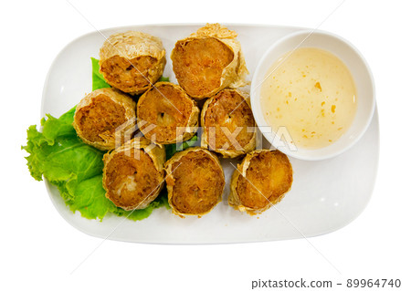Top view of Deep Fried Crab Meat Rolls with sweet sauce, focus selective Top view of Deep Fried Crab Meat Rolls with sweet sauce, focus selective 89964740