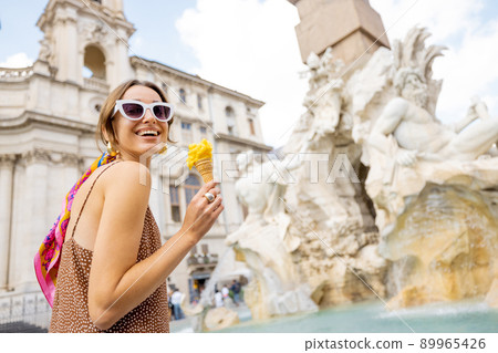 Woman with ice cream while traveling in Rome 89965426