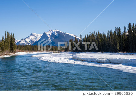 Superb view of Canmore in winter, Bow River, Canadian Rockies, Alberta, Canada 89965820