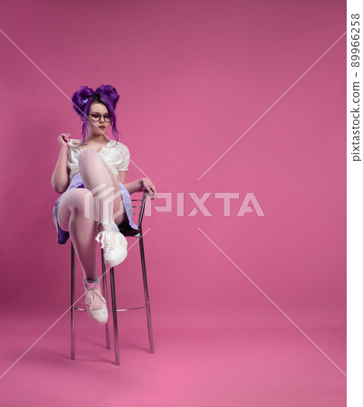 sexy girl with purple hair in summer clothes and beautiful underwear on a pink background sexy girl with purple hair in summer clothes and beautiful underwear on a pink background 89966258