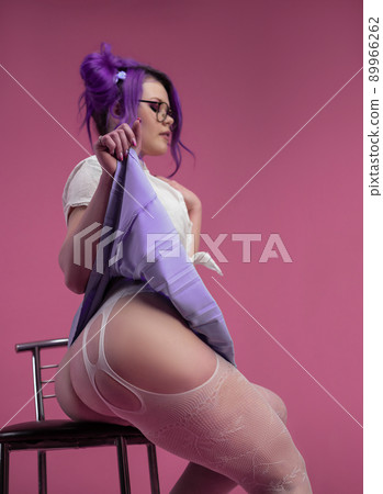 sexy schoolgirl girl with purple hair in summer short clothes and beautiful underwear on a pink background sexy schoolgirl girl with purple hair in summer short clothes and beautiful underwear on a pink background 89966262
