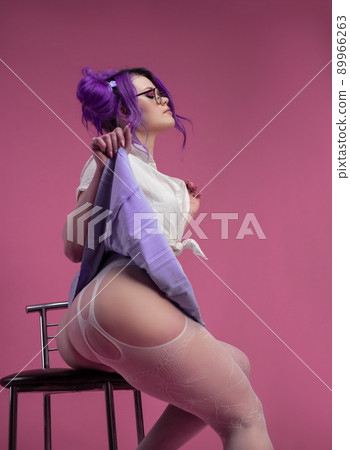 sexy schoolgirl girl with purple hair in summer short clothes and beautiful underwear on a pink background sexy schoolgirl girl with purple hair in summer short clothes and beautiful underwear on a pink background 89966263