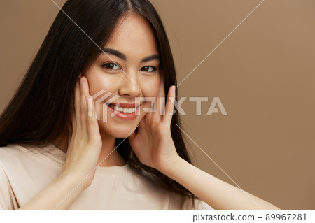 Brunette t-shirt posing modern styles cosmetics beige background Brunette t-shirt posing modern styles cosmetics beige background 89967281