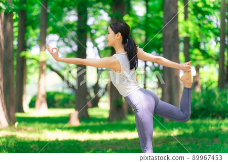 A woman doing yoga in the forest Forest Yoga Park Yoga 89967453