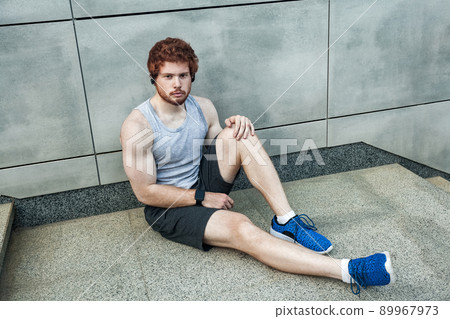 Athlete tired. Looking at camera seriosly. Outdoor Athlete tired. Looking at camera seriosly. Outdoor 89967973