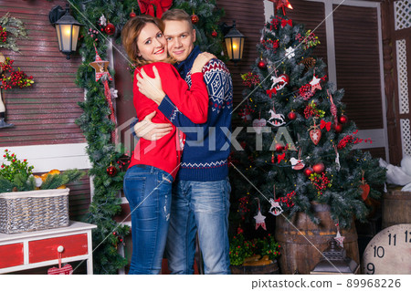 Young beautiful love couple celebrating new year. Woman and man celebrating Christmas 89968226