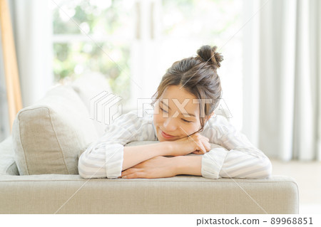 A woman relaxing on the sofa A woman relaxing on the sofa 89968851