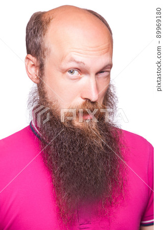 Portrait of a funny bald bearded man against a white background. isolated, studio shot.. Portrait of a funny bald bearded man against a white background. isolated, studio shot.. 89969180