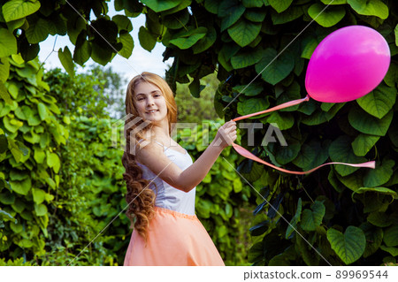 Portrait of happy girl with air balloon enjoying in the park on summertime. Portrait of happy girl with air balloon enjoying in the park on summertime. 89969544