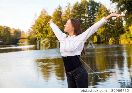 Happiness girl in the park. Autumn, fallen leaves. Happiness girl in the park. Autumn, fallen leaves. 89969750