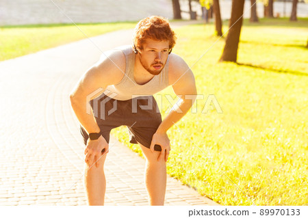 Close up. Redhead young adult man tired after running. Outdoor Close up. Redhead young adult man tired after running. Outdoor 89970133