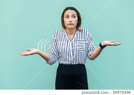 I Dont Know. Handsome blonde businesswoman with looking at camera and confused. 89970496