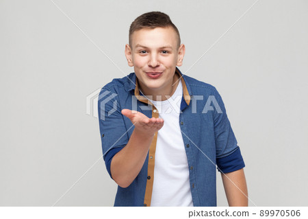 Love concept. Young boy send kiss at camera. Studio shot Love concept. Young boy send kiss at camera. Studio shot 89970506
