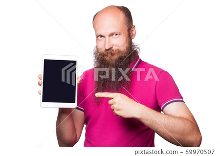 Portrait of bearded bald man holding and using digital tablet on white background 89970507