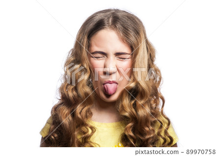 Portrait of crazy funny girl with wavy hairstyle and yellow t shirt. studio shot isolated on white background. Portrait of crazy funny girl with wavy hairstyle and yellow t shirt. studio shot isolated on white background. 89970758