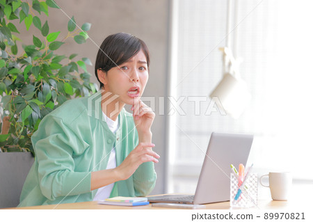 A woman with a troubled face 1 89970821