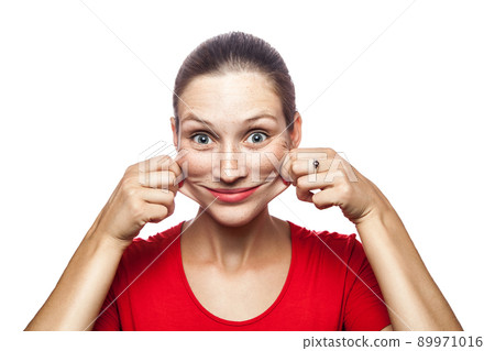Portrait of crazy funny woman in red t-shirt with freckles. looking at camera, studio shot. isolated on white background. Portrait of crazy funny woman in red t-shirt with freckles. looking at camera, studio shot. isolated on white background. 89971016