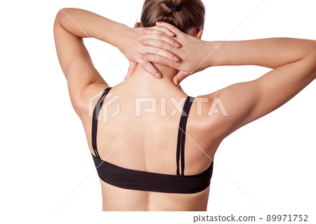 Closeup view of a young woman with shoulder or neck pain on white background. 89971752