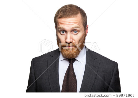 Shocked surprised businessman looking at camera with big eyes. isolated on white, looking at camera. 89971905