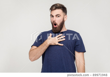 Indignation man looking at camera with exageration emotions and shocked face 89971948