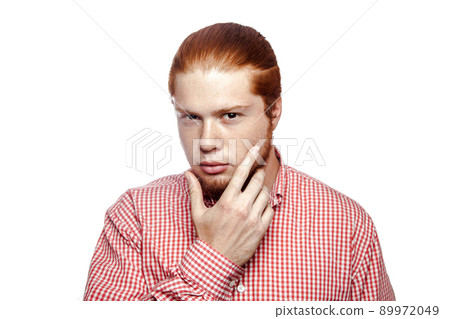 Bearded businessman with red shirt looking at camera. studio shot isolated on white.. Bearded businessman with red shirt looking at camera. studio shot isolated on white.. 89972049